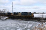 CSX 877 slowly rolls over the low bridge at the confluence of the Paw Paw and St Joseph Rivers